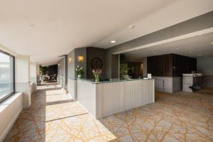 a lobby of a hotel with a reception desk at The Stones Hotel in Salisbury