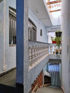 a hallway with a pool in a building at Pousada Guarulhos in Guarulhos