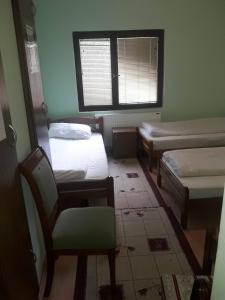 Llit o llits en una habitació de MS Stojic