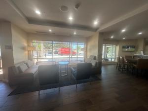 a living room with a couch and chairs and a table at TownePlace Suites by Marriott San Antonio Westover Hills in San Antonio