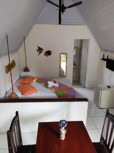 A bed or beds in a room at Pousada Cajibá Imbassaí