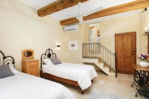 Voodi või voodid majutusasutuse Gozo Escape toas