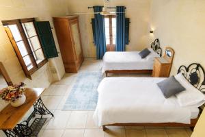 Voodi või voodid majutusasutuse Gozo Escape toas