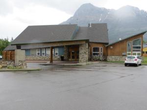 a car parked on the side of a road near a building at Waterton Lakes Lodge Resort in Waterton Park