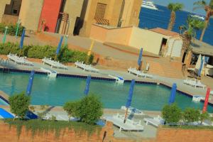 a swimming pool with blue poles in the water at Mashrabiya Hotel in Hurghada