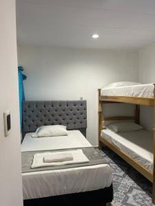 a bedroom with two bunk beds and a bedvisor at HospedajeLR in Barrancabermeja
