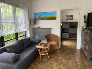 a living room with a couch and a table at Ferienwohnungen Elsterblick Bad Elster in Bad Elster