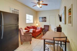 a living room with a refrigerator and a table at Lake Charles Vacation Rental with Private Patio! in Lake Charles