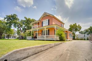 a large orange house with a driveway at Lake Charles Vacation Rental - Walk to the Lake! in Lake Charles