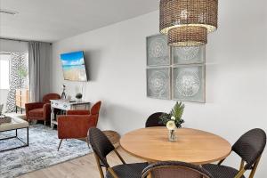 a living room with a table and chairs at Sunset Harbor Palms 1-204 in Navarre