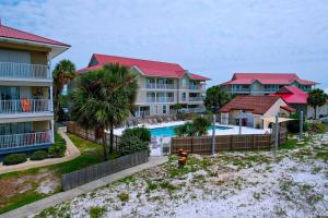 an aerial view of a resort with a pool and houses at Sunset Harbor Palms 1-204 in Navarre