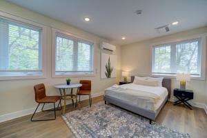 a bedroom with a bed and a table and chairs at DreamStay on Clay in Muskegon