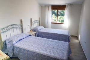En eller flere senge i et værelse på Casa rural Mirador del Río Tus, en Yeste