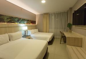 Letto o letti in una camera di Hotel Soratama