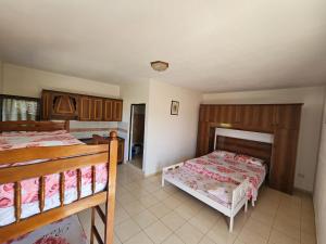 a bedroom with two bunk beds in a room at Sokol Guest House in Velipojë