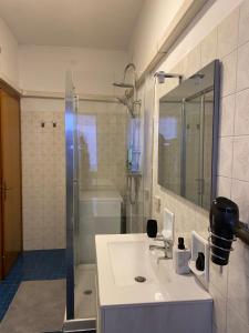 a bathroom with a sink and a shower at venice popular residence in Mestre