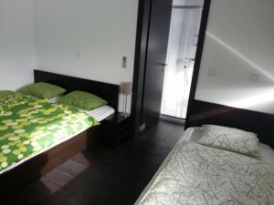 Cama ou camas em um quarto em Raceland Krško
