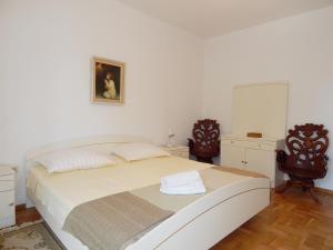 Postel nebo postele na pokoji v ubytování Villa Maristika