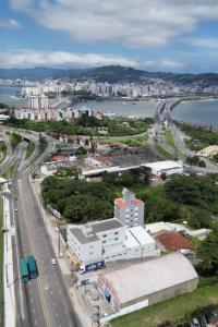 an aerial view of a city with a highway at Ok Inn Hotel Floripa - SOB NOVA GESTÃO in Florianópolis