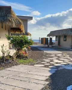 a resort with a pathway leading to the beach at Le Village de Vairao in Vairao