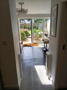 a hallway with a door leading to a patio at Cybil's Retreat - Renovated 2 bedroom house with enclosed garden in Uppingham
