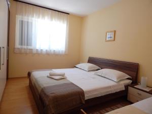 Postel nebo postele na pokoji v ubytování Villa Maristika