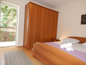 Postel nebo postele na pokoji v ubytování Villa Maristika