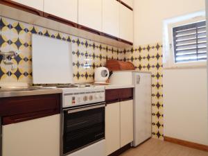 Kuchyň nebo kuchyňský kout v ubytování Villa Maristika