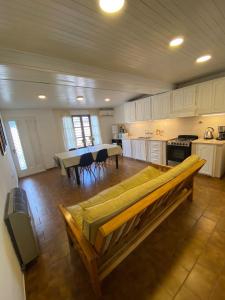 a large kitchen with a couch in the middle of it at Casa 2 habitaciones en barrio céntrico in San Rafael