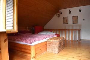 a bedroom with a bed in a attic at Chata Potácelova 1c, Přímělkov, za mostem 200 m, druhá chata, směr Bítovčice 
