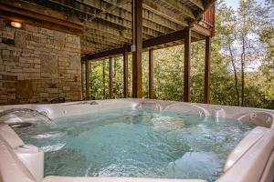 a jacuzzi tub sitting in a room with at Big Bear in McHenry