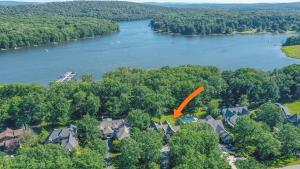 an aerial view of a home with a orange arrow on it at Stilwater Serenity in Swanton