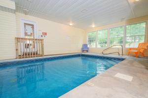 a large swimming pool in a home with at Stilwater Serenity in Swanton