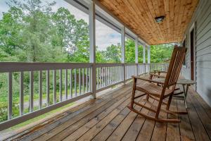 a rocking chair on the porch of a house at Fore Seasons Getaway in McHenry