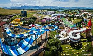 an aerial view of a water park with a water slide at A2 Apartment & Studio in Ružomberok