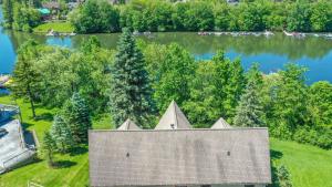 an overhead view of a house on the shore of a lake at Mallard Landing in McHenry