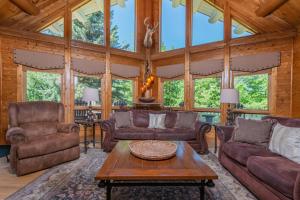 a living room with couches and a table at Mallard Landing in McHenry