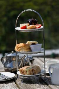 a three tiered tray of pastries on a table at Best Western The Dartmouth Hotel, Golf & Spa in Dartmouth