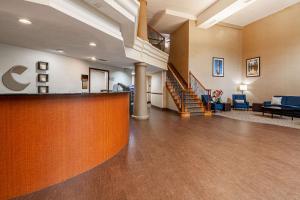 a lobby of a hospital with a waiting area and stairs at Comfort Suites Morrow- Atlanta South in Morrow