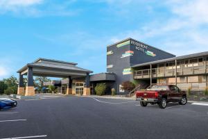 a red truck parked in front of a building at Richland Riverfront Hotel, Ascend Hotel Collection in Richland