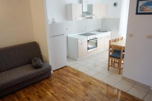 Kuchyň nebo kuchyňský kout v ubytování Apartment Basioli