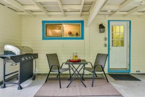 a patio with a table and chairs and a grill at Downtown Home with Patio - Walk to Shops and Dining! in Stevenson