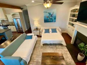 a living room with two beds and a couch at Drake on the Lake - False River, LA 