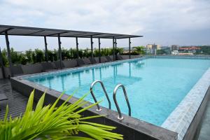 a swimming pool on the roof of a building at The Eden Suite in Accra