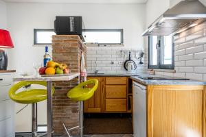 a kitchen with a table with fruit on it at Studio - Old Town Albufeira in Albufeira