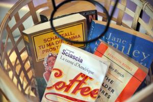 a bunch of books in a basket at Ostello della Gioventù - Il Castello in Noto