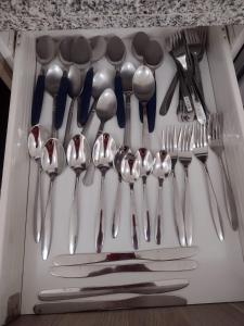 a drawer filled with spoons and forks and knives at Hermosa casa en Acapulco con club de Playa. in Acapulco