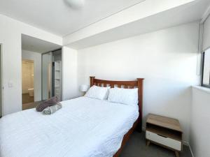 Katil atau katil-katil dalam bilik di SkyPark Oasis Retreat 2Br@ close to Olympicpark