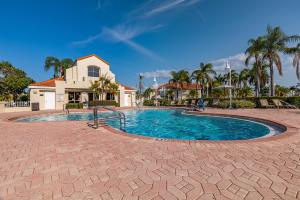 a swimming pool in the middle of a resort at Newly Updated St. Pete 2-BR Condo on Isla Del Sol in St Petersburg