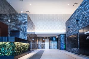 a lobby with a fish tank at Apartment Hotel 11 Namba-Minami Ebisucho-Eki Mae in Osaka